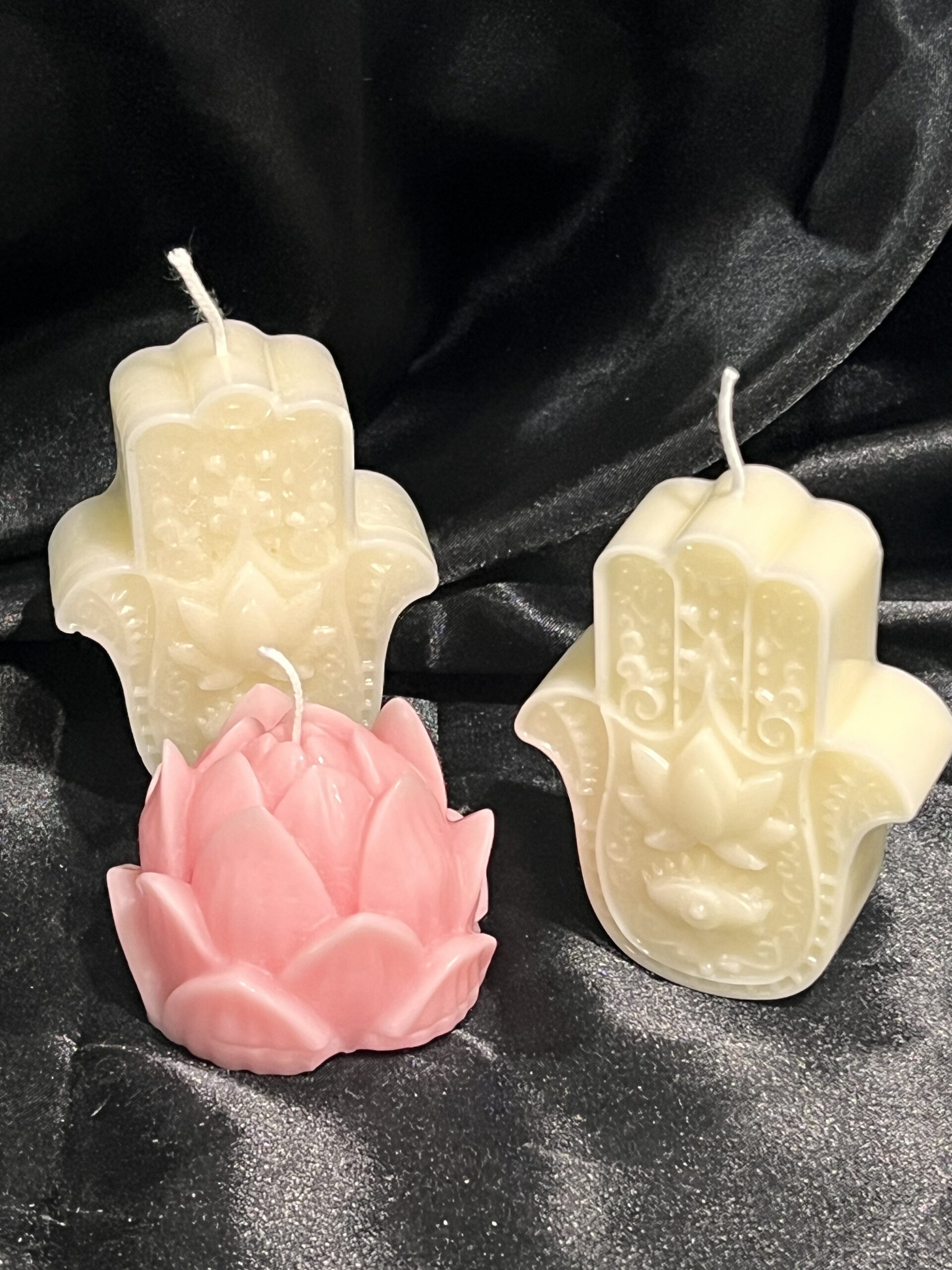 Spiritual ritual candle with Hamsa symbol for meditation and energy cleansing
