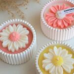 handmade daisy candle in luxury gypsum vessel for home decor